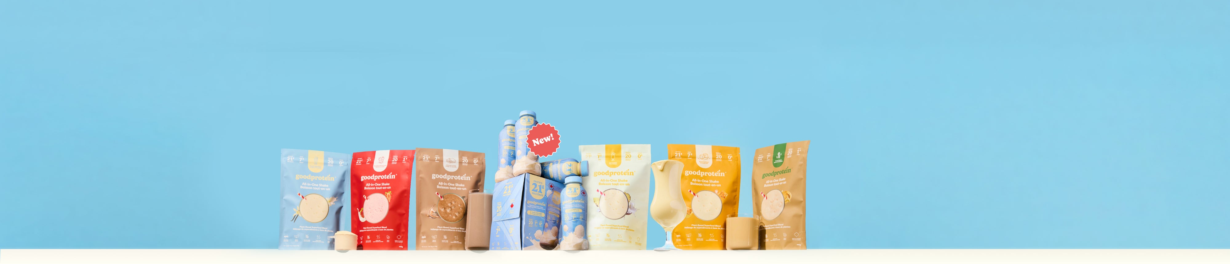 A row of assorted packaged grocery items, including bags and boxes of bread, cereal, and snacks, arranged against a solid light blue background.