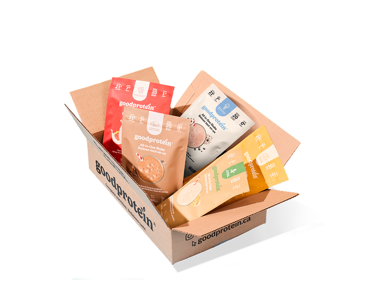 A Good Protein subscription box filled with various protein powder pouches in red, beige, white, and yellow, photographed on a clean white background.